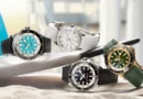 Az új Breitling Superocean órakollekció több darabja egy szörfdeszkán.