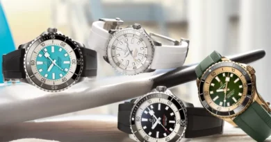 Az új Breitling Superocean órakollekció több darabja egy szörfdeszkán.