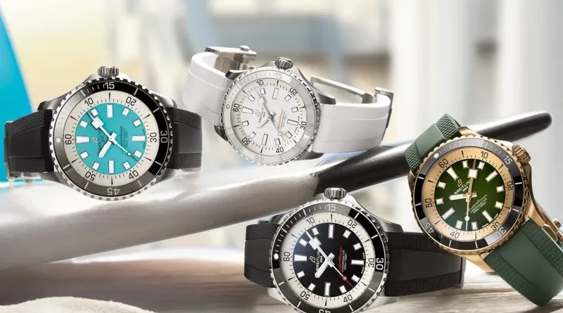 Az új Breitling Superocean órakollekció több darabja egy szörfdeszkán.